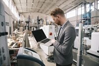 Manager checks machines at the factory. Inspector checks a factory.
