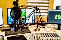 Microphone and mixer at the radio station studio broadcasting news
